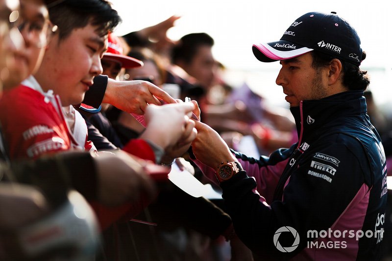 Sergio Perez, Racing Point signs an autograph for a fan
