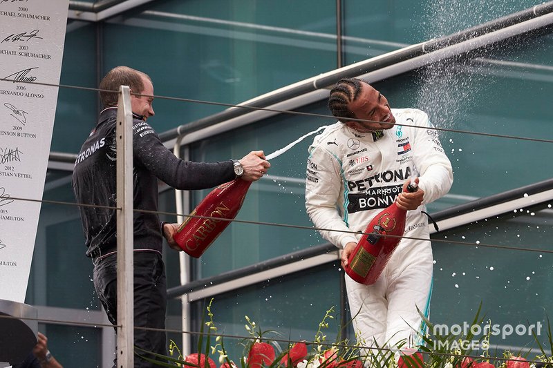 Lewis Hamilton, Mercedes AMG F1, 1st position, celebrates with his team mate on the podium