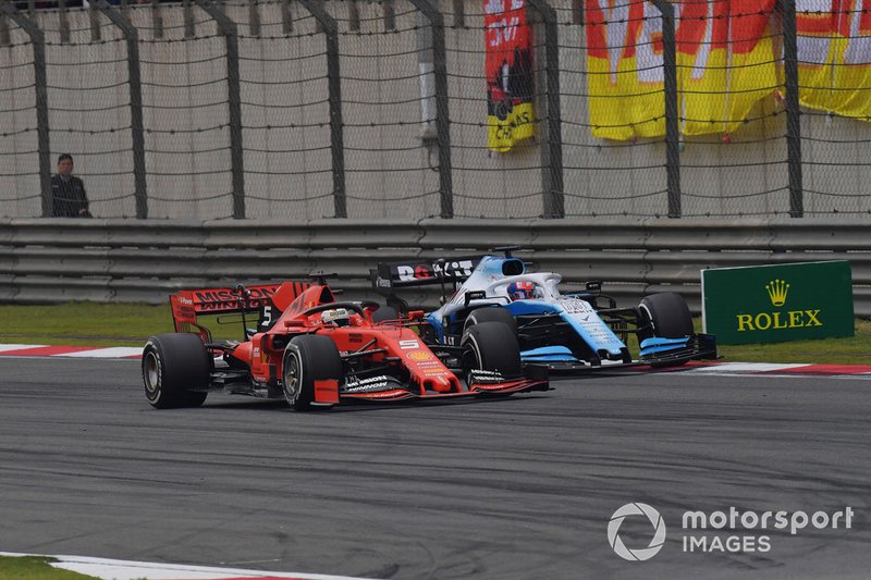 Sebastian Vettel, Ferrari SF90, leads George Russell, Williams Racing FW42