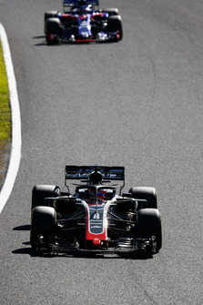 Romain Grosjean, Haas F1 Team VF-18, leads Pierre Gasly, Scuderia Toro Rosso STR13