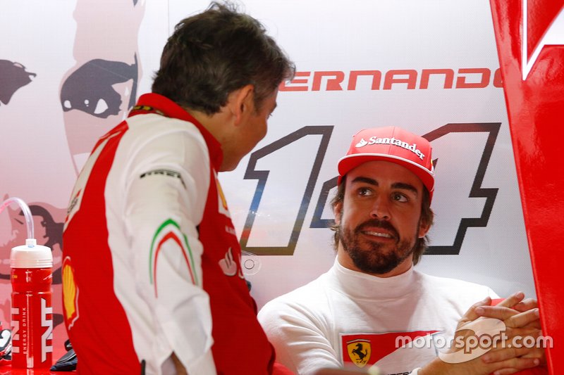 Fernando Alonso, Ferrari, and Marco Mattiacci, Team Principal, Ferrari,in the garage