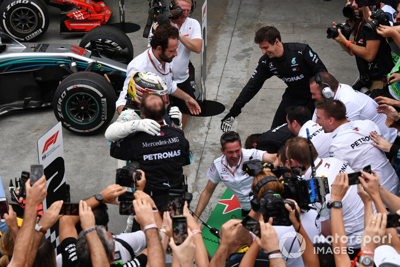 Barriers collapse as Lewis Hamilton, Mercedes AMG F1 celebrates with his mechanics in Parc Ferme 