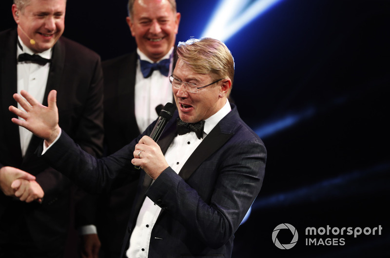 Mika Hakkinen receives a Gregor Grant Award on stage