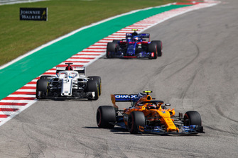 Stoffel Vandoorne, McLaren MCL33, leads Marcus Ericsson, Sauber C37, and Pierre Gasly, Scuderia Toro Rosso STR13
