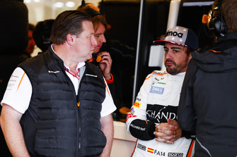 Zak Brown, Executive Director, McLaren Racing, talks with Fernando Alonso, McLaren, in the garage