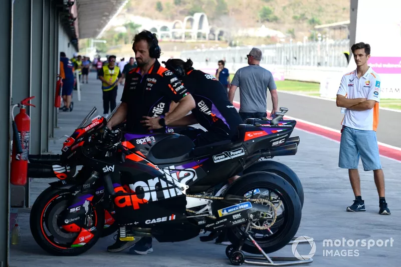 Luca Marini, Repsol Honda Team looking at the Aprilia Racing bikes