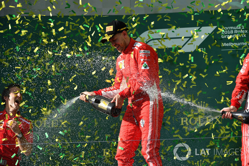 Race winner Sebastian Vettel, Ferrari celebrates on the podium with the champagne