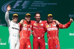 Second place Valtteri Bottas, Mercedes AMG F1, Race winner Sebastian Vettel, Ferrari, Giuseppe Vieti