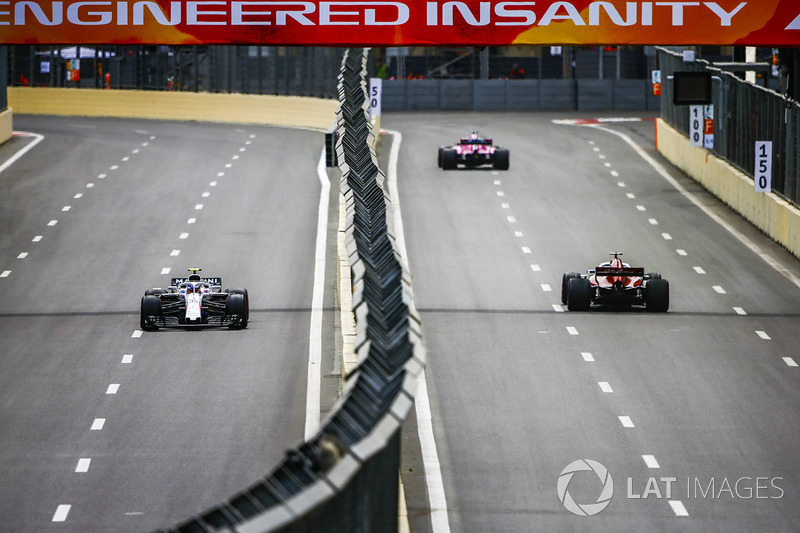Marcus Ericsson, Sauber C37 Ferrari, leads Carlos Sainz Jr., Renault Sport F1 Team R.S. 18