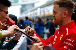 Sebastian Vettel, Ferrari, signs autograph for fans