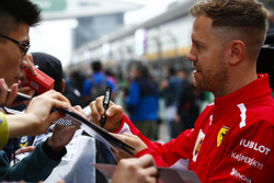 Sebastian Vettel, Ferrari, signs autograph for fans