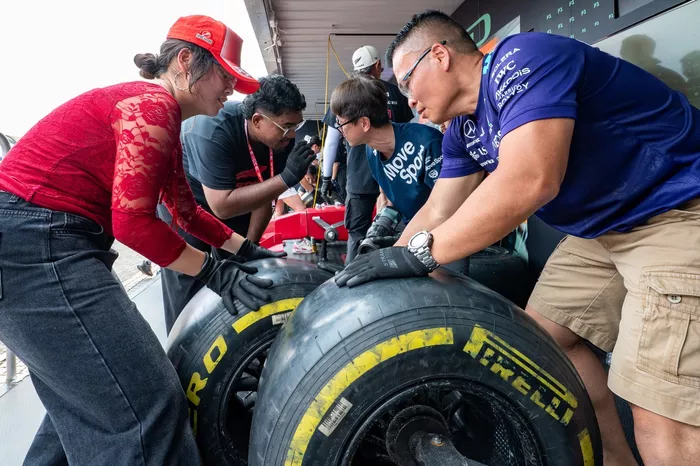 Fans participating in the pit stop challenge
