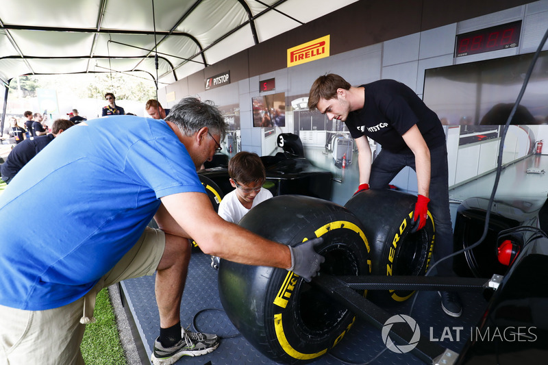 Fans take part in the pit stop challenge in the F1 Fanzone