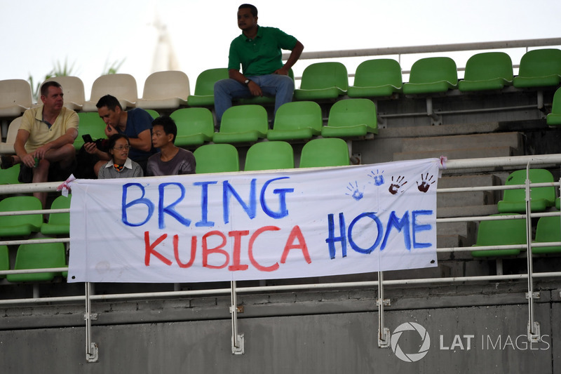 Fans and "Bring Kubica Home" banner signage for Robert Kubica