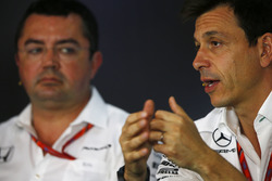 Toto Wolff, Executive Director Mercedes AMG F1 alongside Eric Boullier, Racing Director, McLaren