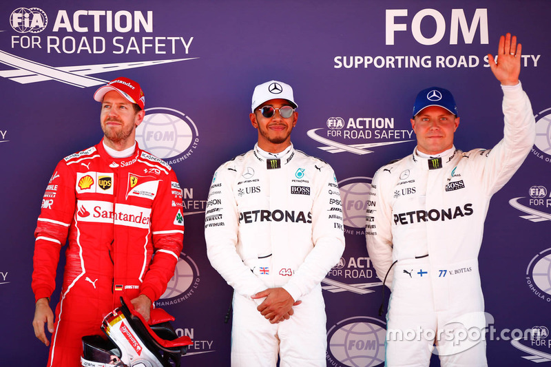 Polesitter Lewis Hamilton, Mercedes AMG F1, second place, Sebastian Vettel, Ferrari, third place Val