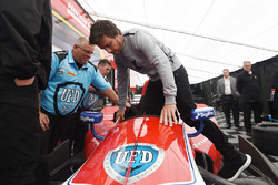 Fernando Alonso sits in the car of Marco Andretti