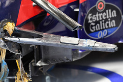 The crashed car of Carlos Sainz Jr., Scuderia Toro Rosso STR12 in the garage after FP1 shwoing broken suspension and wheel tethers