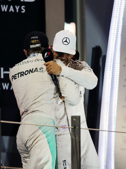 World Champion Nico Rosberg, Mercedes AMG F1 shakes hands with team mate and race winner Lewis Hamil