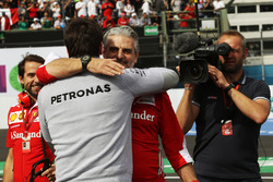 Maurizio Arrivabene, Ferrari Team Principal celebrates at the podium with Toto Wolff, Mercedes AMG F1 Shareholder and Executive Director