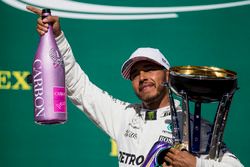 Race winner Lewis Hamilton, Mercedes AMG F1, with his pink Champagne bolt and trophy on the podium