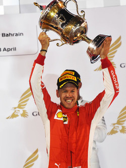 Race winner Sebastian Vettel, Ferrari celebrates on the podium with the trophy