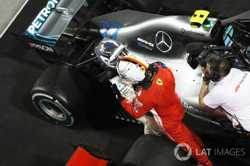 Valtteri Bottas, Mercedes AMG F1, 2nd position, congratulates Sebastian Vettel, Ferrari, 1st position, on victory in Parc Ferme