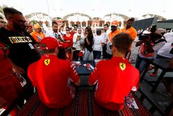 Sebastian Vettel, Ferrari, and Kimi Raikkonen, Ferrari, sign autographs for fans
