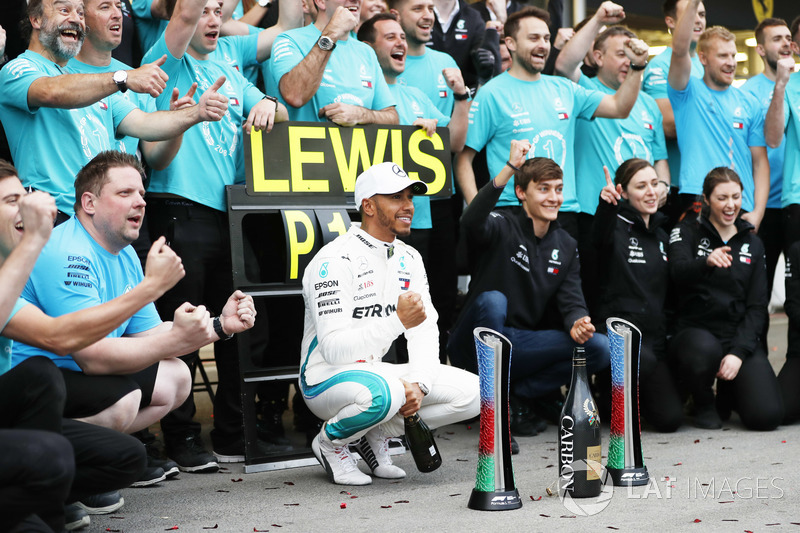 Lewis Hamilton, Mercedes AMG F1, and George Russell celebrate with the team after the race