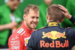 Sebastian Vettel, Ferrari and Max Verstappen, Red Bull Racing in parc ferme