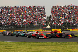 Max Verstappen, Red Bull Racing RB13 leads at the start of the race and collides with Sebastian Vettel, Ferrari SF70H