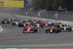 Max Verstappen, Red Bull Racing RB13 and Sebastian Vettel, Ferrari SF70H battle at the start of the race