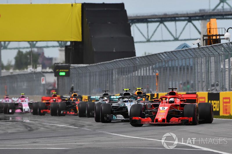 Sebastian Vettel, Ferrari SF71H leads at the start of the race