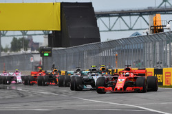 Sebastian Vettel, Ferrari SF71H leads at the start of the race