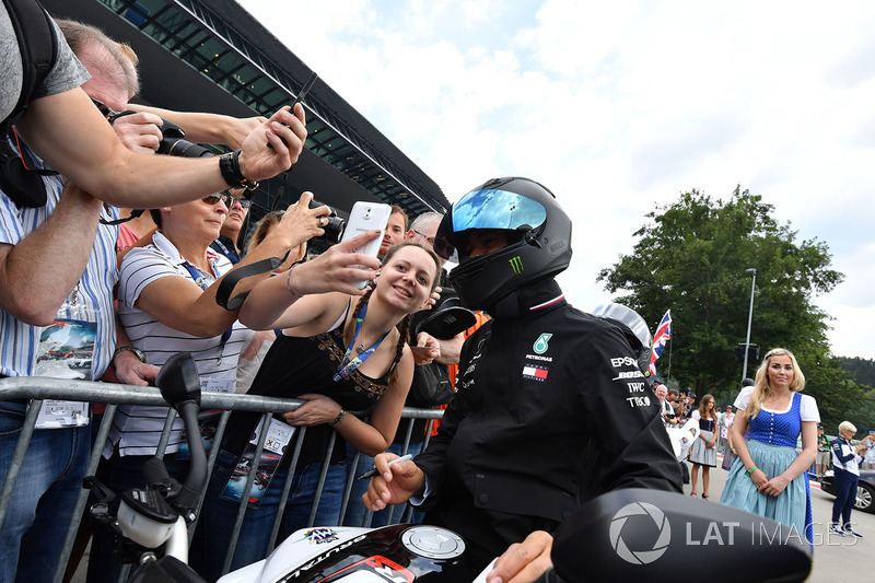 Lewis Hamilton, Mercedes-AMG F1 on his MV Agusta motorbike and fans selfie