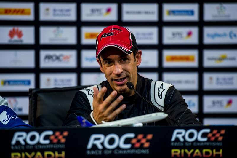 Helio Castroneves of Team Latin America talks in the press conference