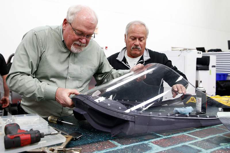 Jeff Horton, INDYCAR Director of Engineering/Safety, and Dr. Terry Trammell, INDYCAR safety consultant, install a windscreen on the 2018 Indy car in preparation for the first test