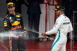 Lewis Hamilton, Mercedes AMG F1, and Race winner Daniel Ricciardo, Red Bull Racing, sprays with Champagne