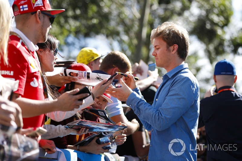 Nico Rosberg signs autographs for fans