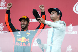 Lance Stroll, Williams celebrates on the podium, race winner Daniel Ricciardo, Red Bull Racing and does a Shoey