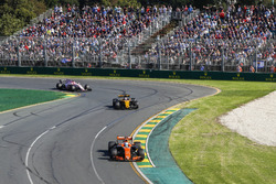 Fernando Alonso, McLaren MCL32, leads Nico Hulkenberg, Renault Sport F1 Team RS17, and Esteban Ocon,