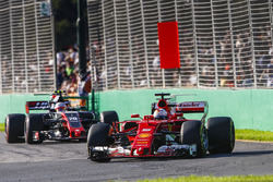 Sebastian Vettel, Ferrari SF70H, leads Kevin Magnussen, Haas F1 Team VF-17