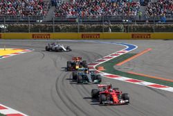 Kimi Raikkonen, Ferrari SF70H leads Lewis Hamilton, Mercedes AMG F1 W08