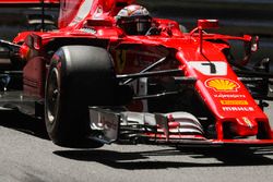 Kimi Raikkonen, Ferrari SF70H, lifts a wheel whilst turning