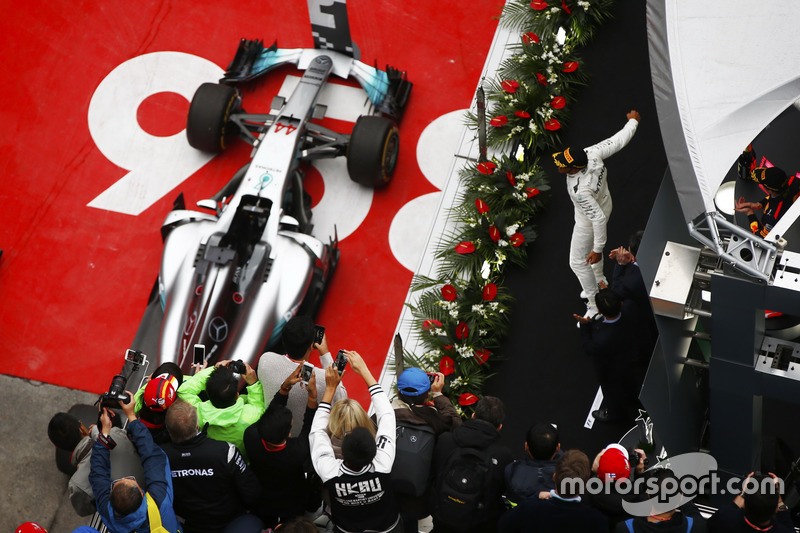 Lewis Hamilton, Mercedes AMG F1 W08, celebrates on the podium ahead of Sebastian Vettel, Ferrari SF70H and Max Verstappen, Red Bull Racing RB13