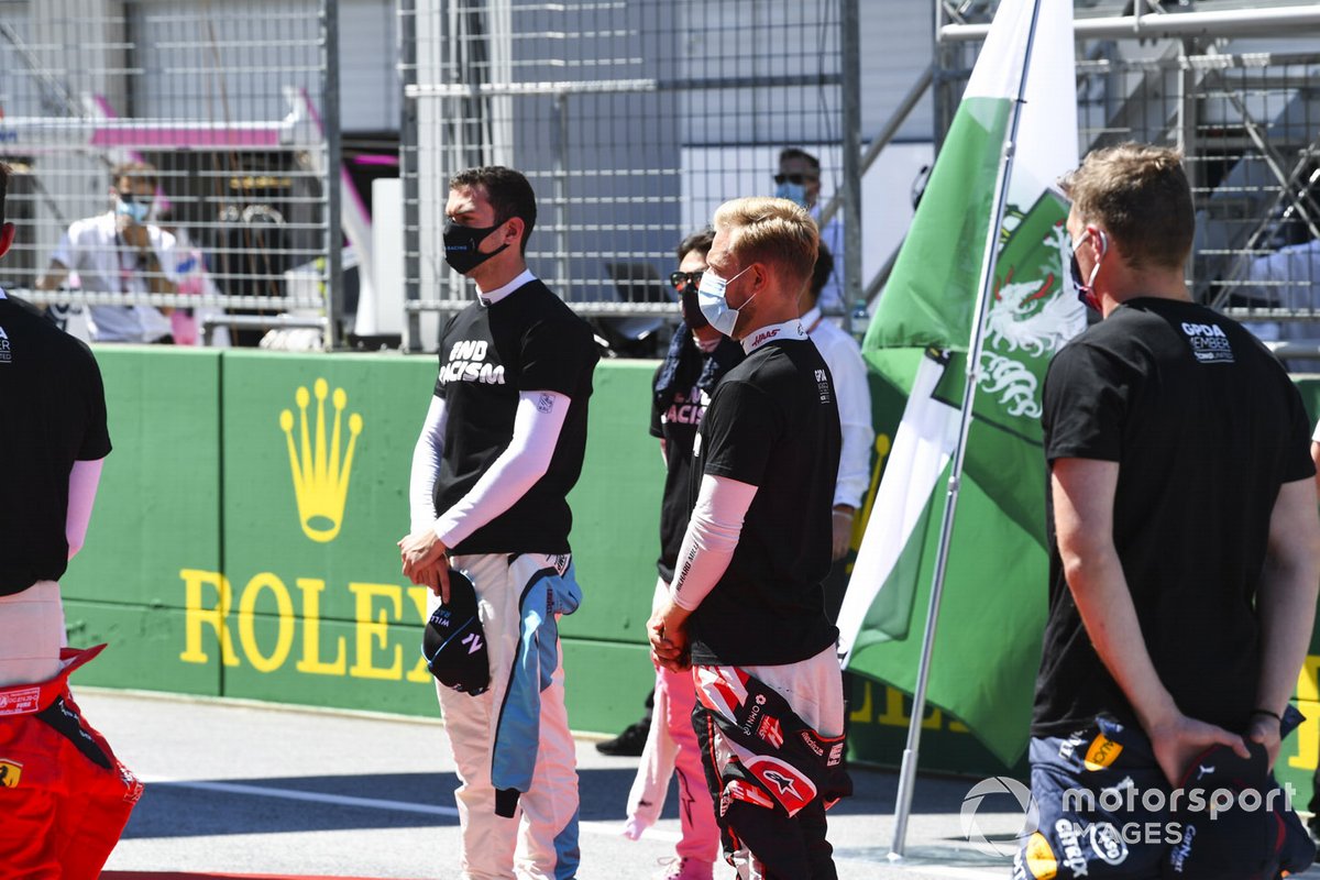 Nicholas Latifi, Williams Racing, Kevin Magnussen, Haas F1, and Max Verstappen, Red Bull Racing, on the grid prior to the start