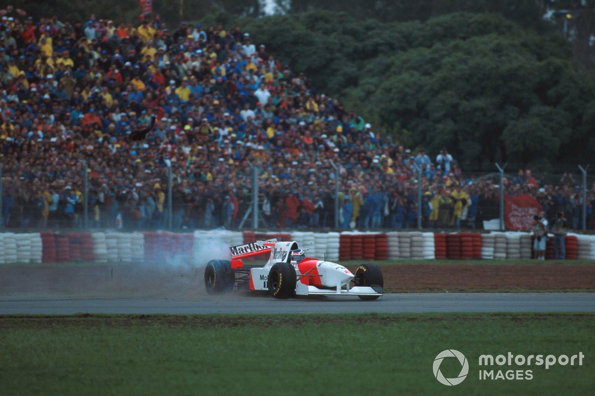 Mika Hakkinen, Mclaren MP4-10 spins off after collision with Eddie Irvine