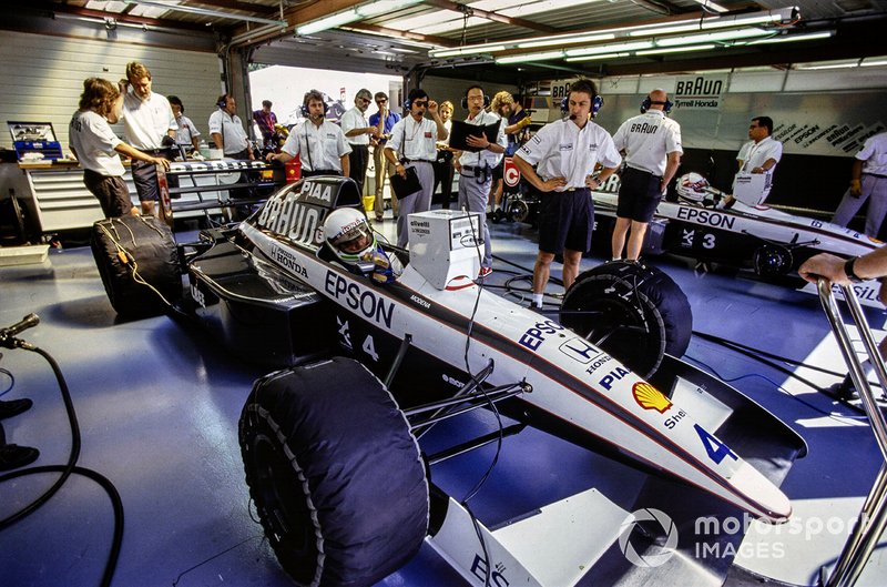 Stefano Modena, Tyrrell 020 Honda, in the pits alongside Satoru Nakajima, Tyrrell 020 Honda