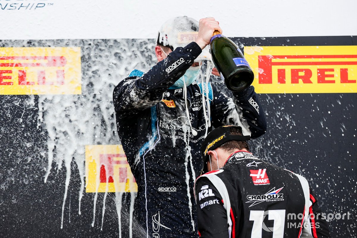 Race Winner Dan Ticktum, Dams and Louis Deletraz, Charouz Racing System celebrate on the podium with the champagne