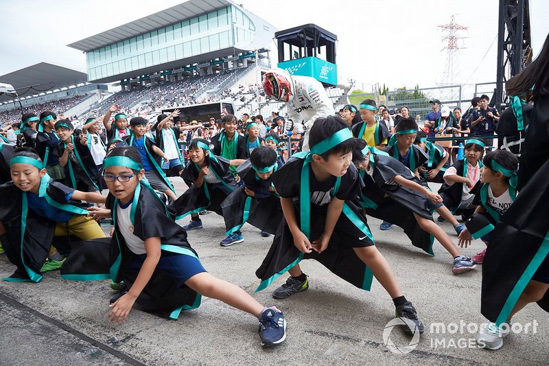 Lewis Hamilton, Mercedes AMG F1, or an impersonator, meets young fans